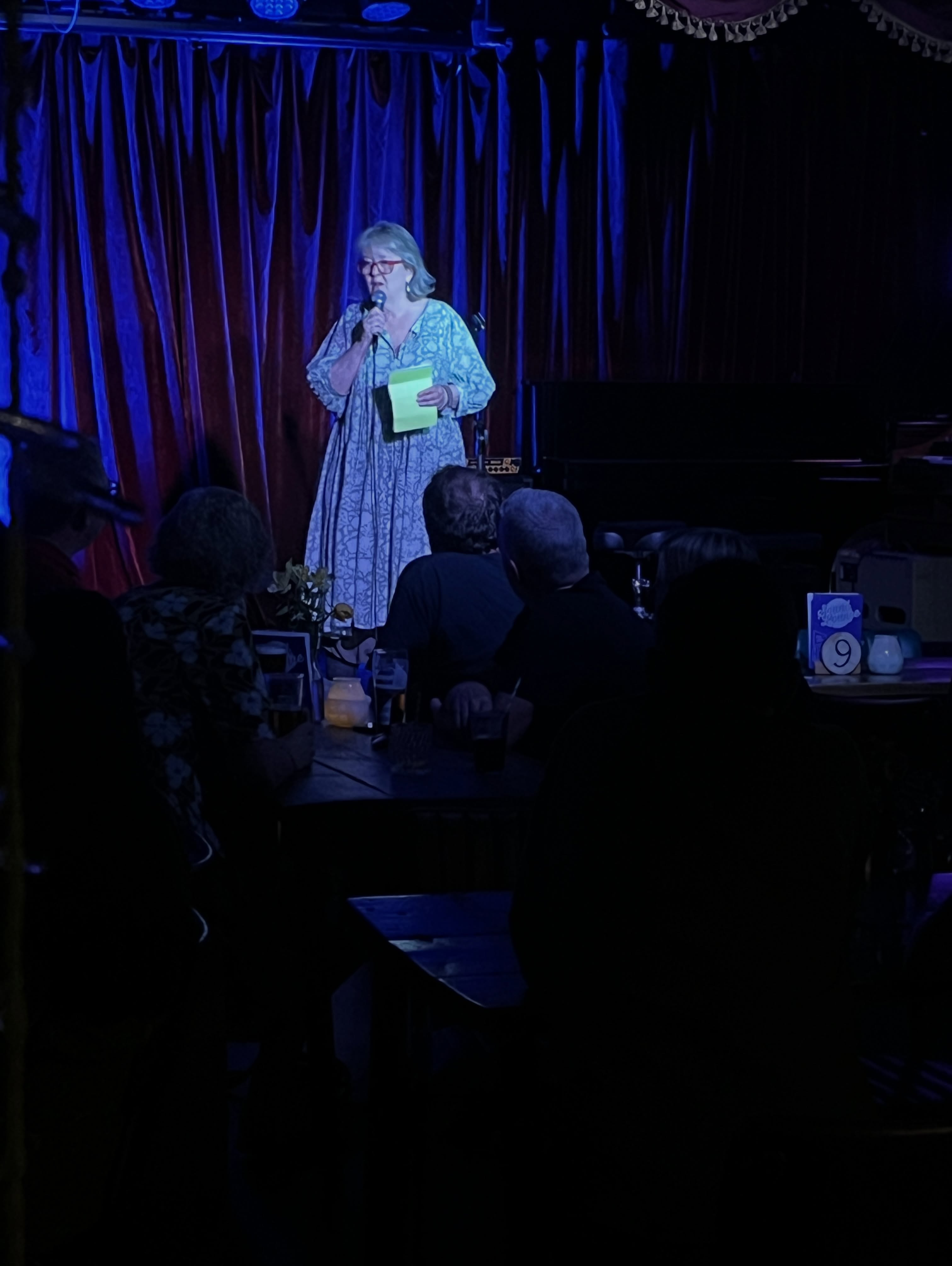 A comedian speaking on the Sound Lounge stage